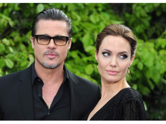 LONDON, ENGLAND - MAY 08: Brad Pitt and Angelina Jolie attend a private reception as costumes and props from Disney's 'Maleficent' are exhibited in support of Great Ormond Street Hospital at Kensington Palace on May 8, 2014 in London, England. (Photo by Eamonn M. McCormack/Getty Images)