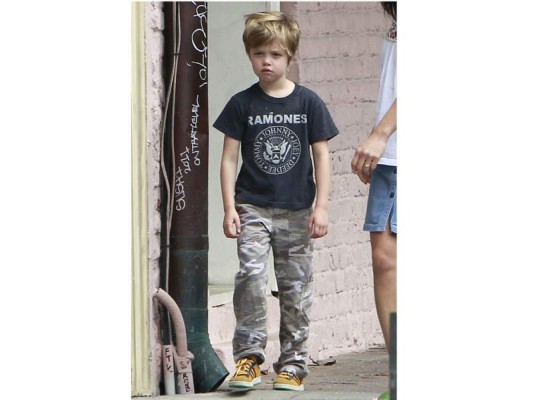 74405, NEW ORLEANS, LOUISIANA - Wednesday March 7, 2012. Three of Angelina Jolie and Brad Pitt's 6 children Zahara, Maddox and Shiloh take a walk to the market for snacks with their nanny and their English bulldog, Jacques. Along the way, the siblings took turns walking Jacques. Maddox chatted on a cell phone, showing that the 10 year old is inching ever closer to becoming a teenager. Tomboy Shiloh showed off her punk spirit in a Ramones shirt and Zahara clung close to her sister. Photograph: Juan Sharma, PacificCoastNews.com **FEE MUST BE AGREED PRIOR TO USAGE** **E-TABLET/IPAD & MOBILE PHONE APP PUBLISHING REQUIRES ADDITIONAL FEES**ÊLOS ANGELES OFFICE:1 310 822 0419ÊÊLONDON OFFICE:+44 208 090 4079 74405, NEW ORLEANS, LOUISIANA - Wednesday March 7, 2012. Three of Angelina Jolie and Brad Pitt's 6 children Zahara, Maddox and Shiloh take a walk to the market for snacks with their nanny and their English bulldog, Jacques. Along the way, the siblings took turns walking Jacques. Maddox chatted on a cell phone, showing that the 10 year old is inching ever closer to becoming a teenager. Tomboy Shiloh showed off her punk spirit in a Ramones shirt and Zahara clung close to her sister. Photograph: Juan Sharma, PacificCoastNews.com **FEE MUST BE AGREED PRIOR TO USAGE** **E-TABLET/IPAD & MOBILE PHONE APP PUBLISHING REQUIRES ADDITIONAL FEES**ÊLOS ANGELES OFFICE:1 310 822 0419ÊÊLONDON OFFICE:+44 208 090 4079