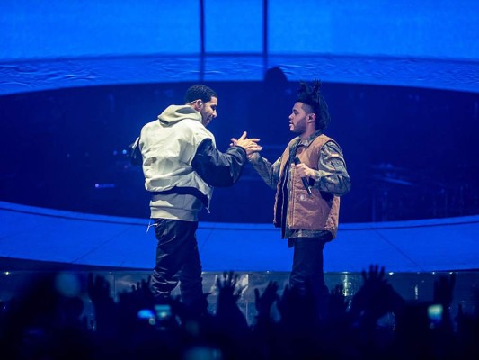 NOTTINGHAM, UNITED KINGDOM - MARCH 16: Drake and The Weeknd performs on stage during a date of his 'Nothing Was the Same' 2014 World Tour at Nottingham Capital FM Arena on March 16, 2014 in Nottingham, England. (Photo by Ollie Millington/WireImage) NOTTINGHAM, UNITED KINGDOM - MARCH 16: Drake and The Weeknd performs on stage during a date of his 'Nothing Was the Same' 2014 World Tour at Nottingham Capital FM Arena on March 16, 2014 in Nottingham, England. (Photo by Ollie Millington/WireImage)