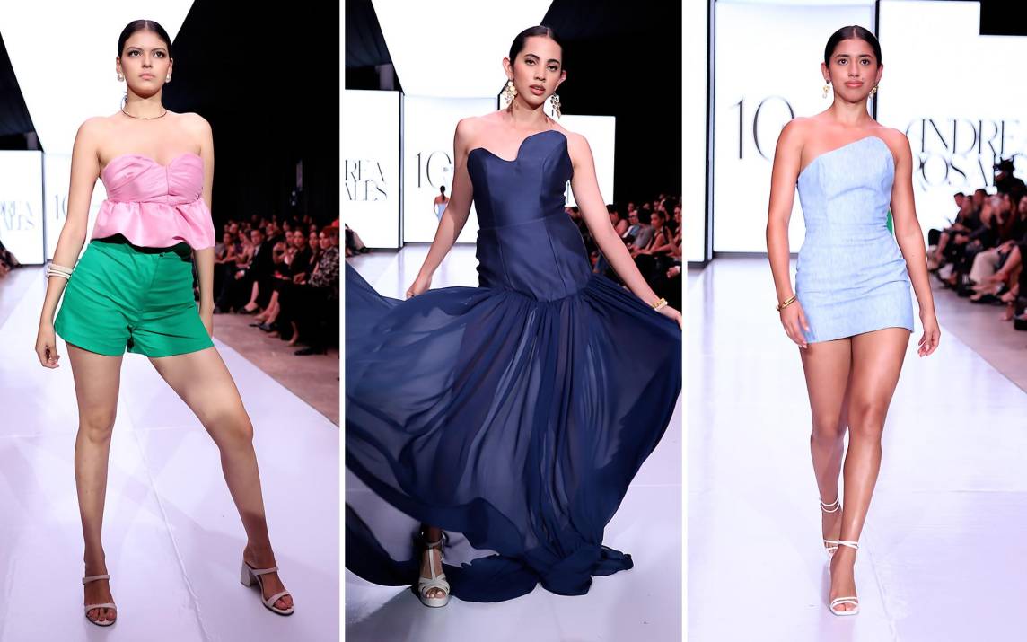 Andrea Rosales llegó a la pasarela de Bac Estilo Moda con cinco looks que juegan con la arquitectura de la prenda y la fluidez de los materiales. Desde tops masculinos y asimétricos hasta vestidos cortos y largos con varillas estratégicas, la colección combina lino, shantung, crepé y chiffon en una paleta que va del rosa al azul profundo.