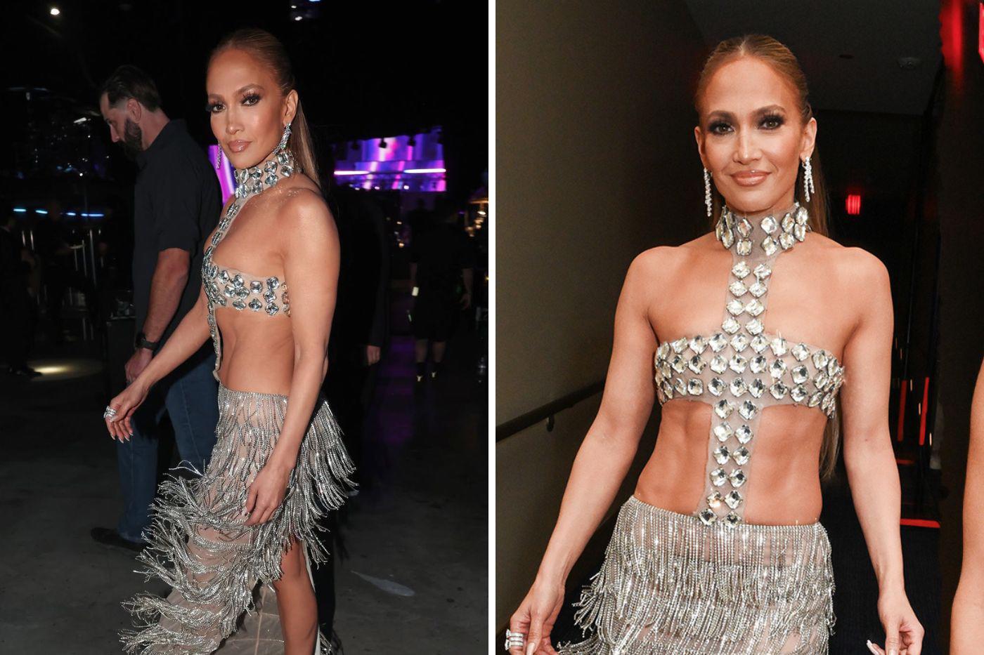 ¡En uno de sus looks más atrevidos! J.Lo brilló con un conjunto de Bronx and Banco compuesto por un top y falda con flecos, adornado con diamantes y cortes que dejaban al descubierto su abdomen tonificado. 