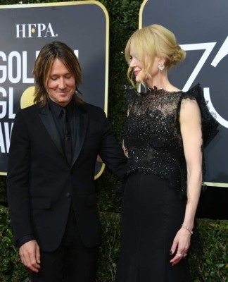 Nicole Kidman (R) and Keith Urban arrive for the 75th Golden Globe Awards on January 7, 2018, in Beverly Hills, California. / AFP PHOTO / VALERIE MACON