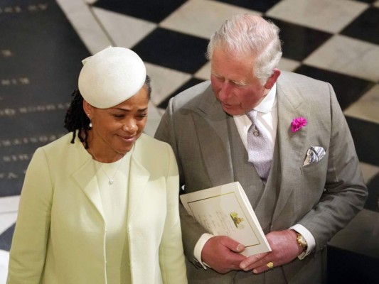 Britain's Prince Charles, Prince of Wales and Meghan Markle's mother Doria Ragland (L) depart from St George's Chapel after the wedding ceremony of Britain's Prince Harry, Duke of Sussex and US actress Meghan Markle in St George's Chapel, Windsor Castle, in Windsor, on May 19, 2018. / AFP PHOTO / POOL / OWEN HUMPHREYS