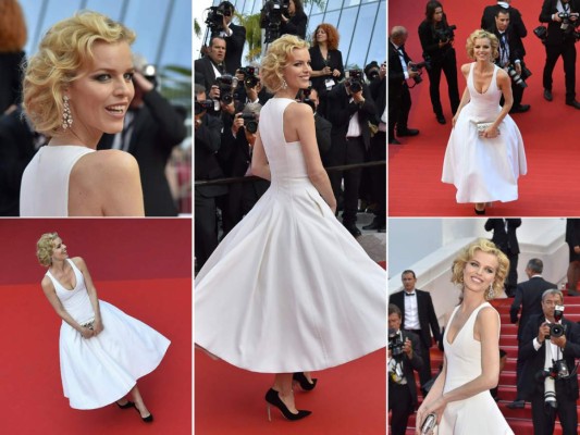 Eva Herzigova en un vestido de estilo años 50, stilettos clásicos negros, y pendientes de oro blanco y diamantes de Chopard.