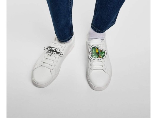 White sneaker with patches