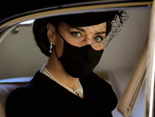 Britain's Catherine, Duchess of Cambridge, arrives to attend the funeral ceremony of Britain's Prince Philip, Duke of Edinburgh at St George's Chapel in Windsor Castle in Windsor, west of London, on April 17, 2021. - Philip, who was married to Queen Elizabeth II for 73 years, died on April 9 aged 99 just weeks after a month-long stay in hospital for treatment to a heart condition and an infection. (Photo by CHRIS JACKSON / POOL / AFP)