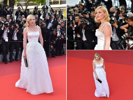 Kirsten Dunst en un diseño bordado by Christian Dior. Zapatos y clutch by Salvatore Ferragamo