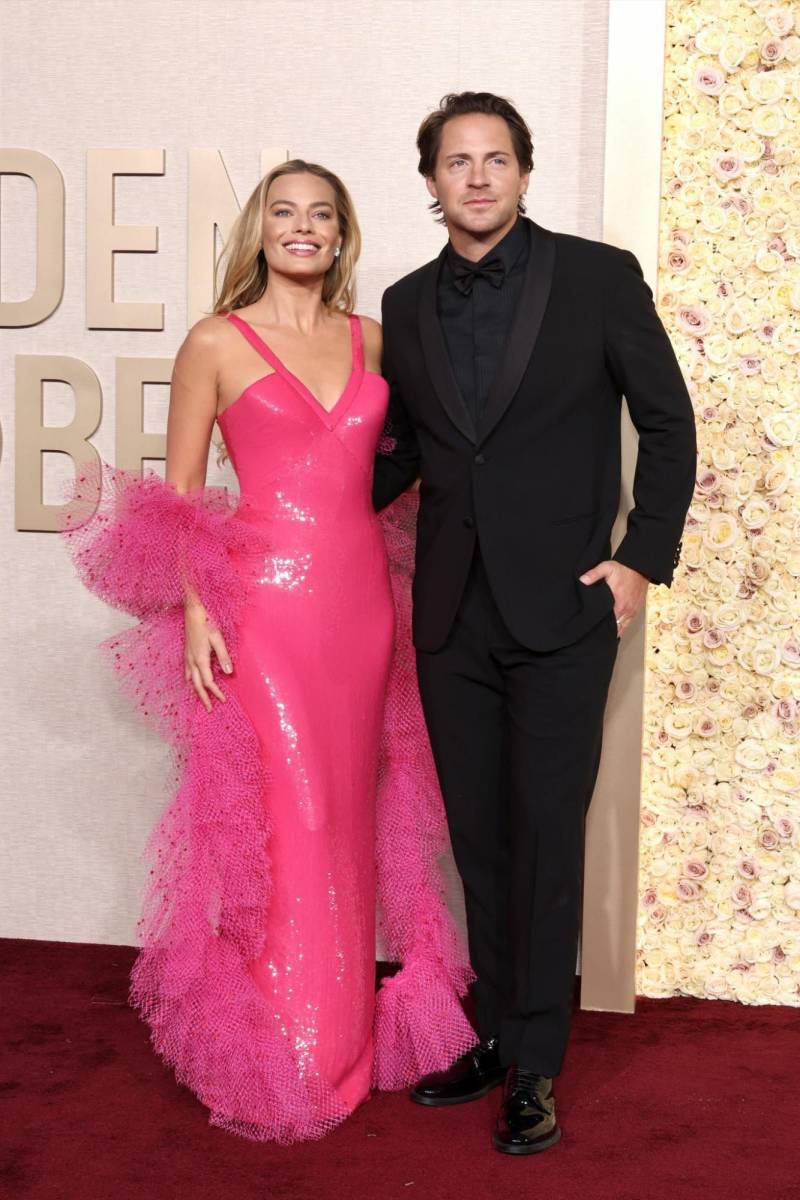Margot Robbie y Tom Ackerley.