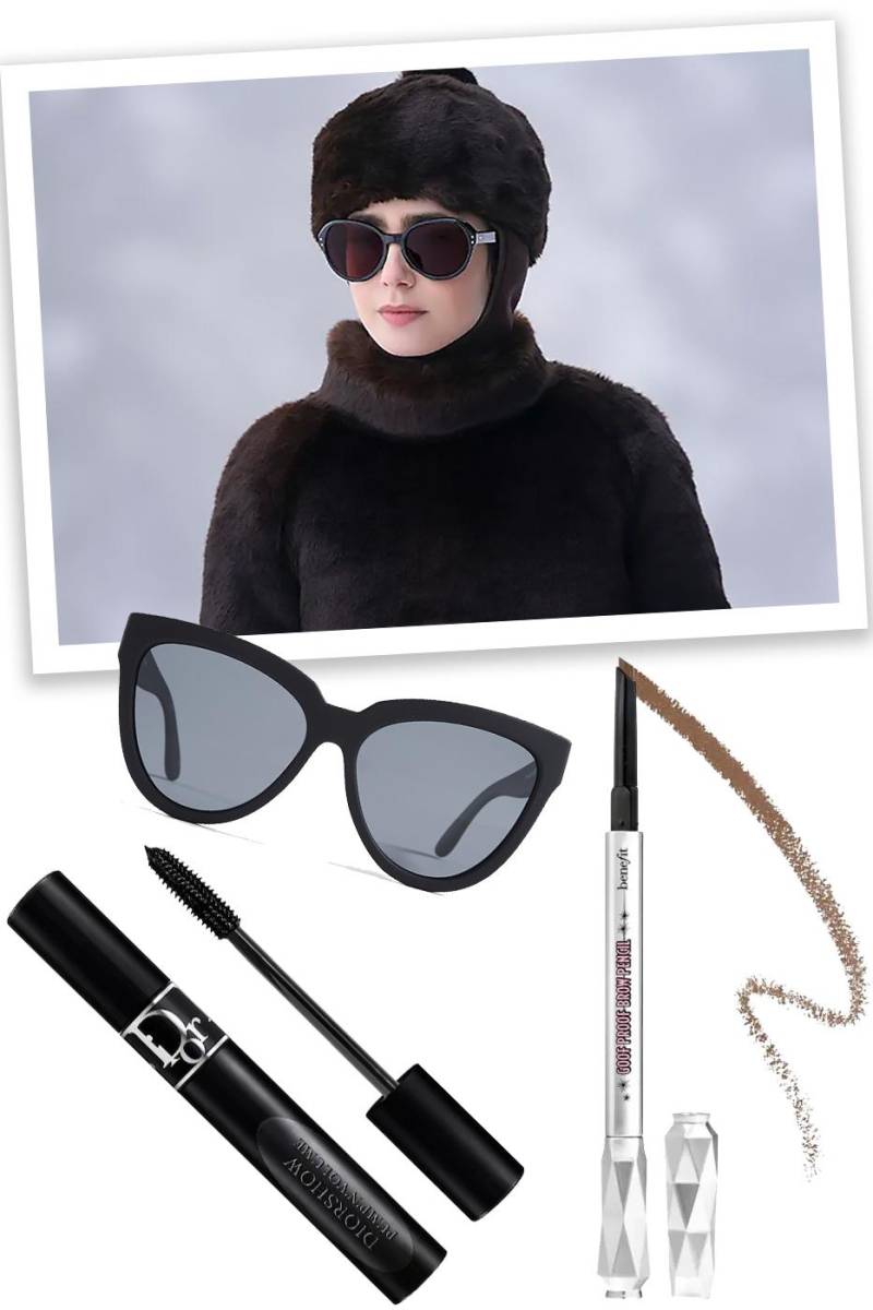  Unas grandes gafas negras y un un abrigo de pelo de cuello alto en color marrón a conjunto con un gorro que cubre todo su pelo y unas gafas de sol estilo aviador del mismo tono, así luce Emily Cooper escena similar al de Audrey Hepburn en <i>Charada</i>.