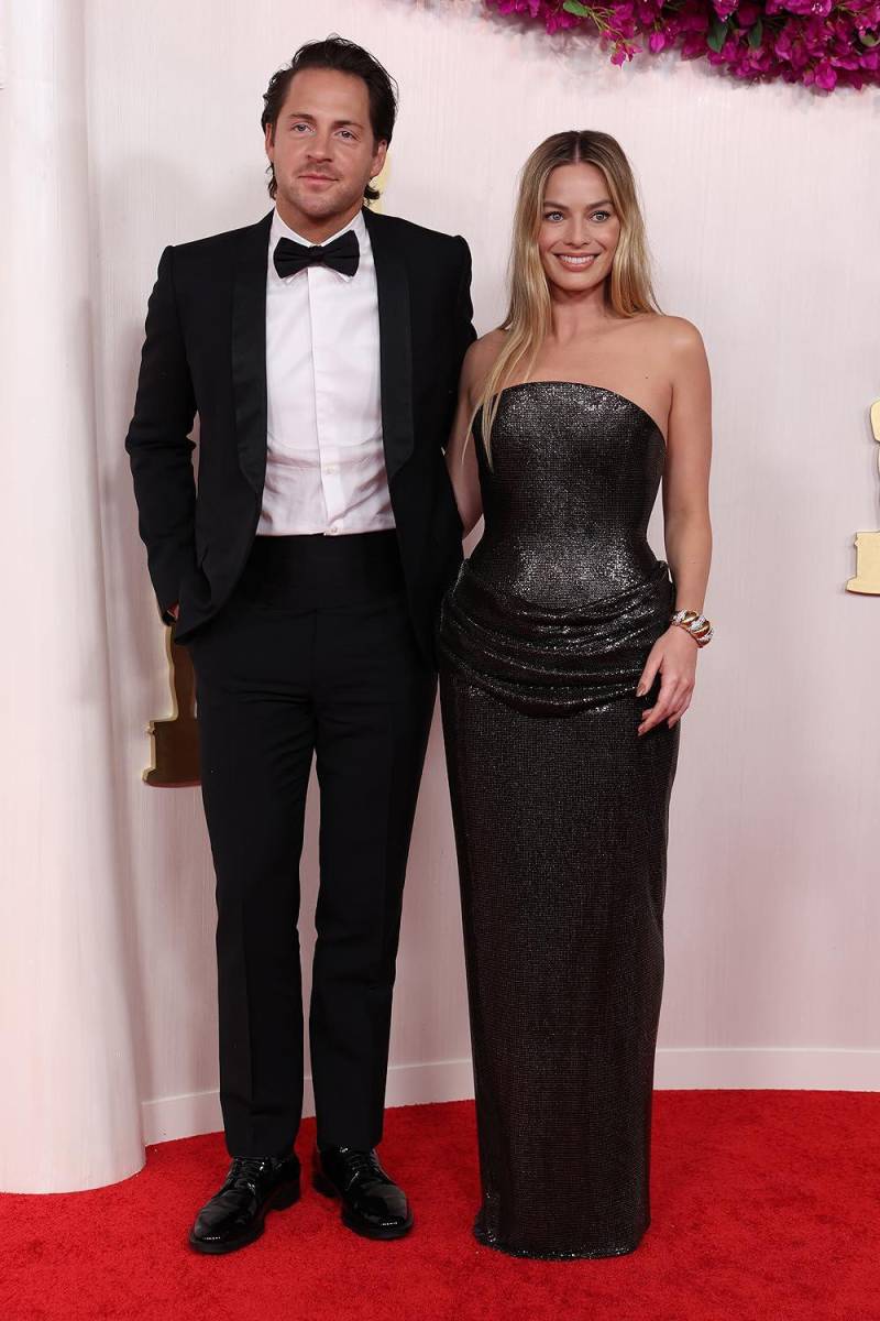 Tom Ackerley y Margot Robbie. 
