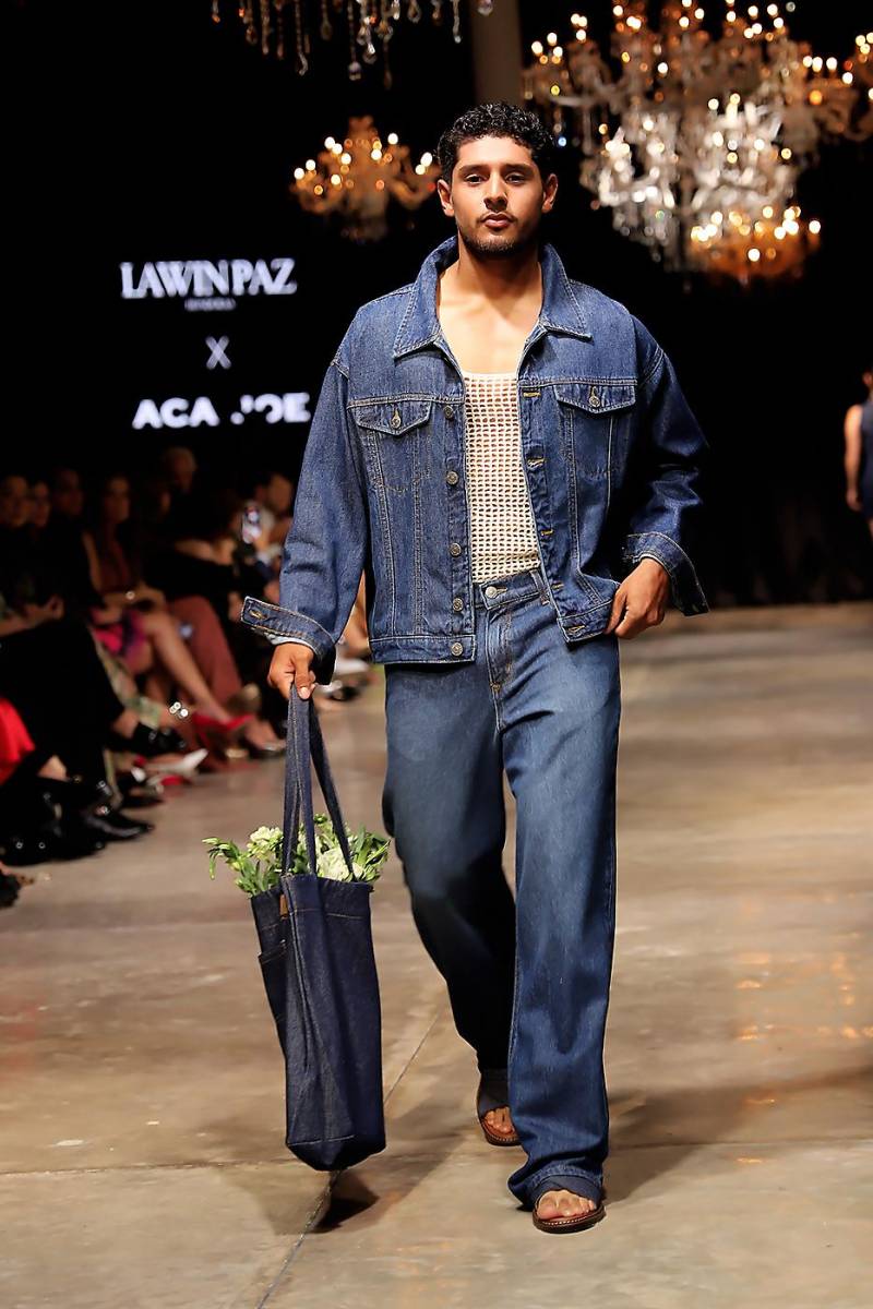 Las piezas de denim de alta calidad fusionan la tradición y la innovación que caracterizan a ambas marcas. “La colaboración con ACA JOE no solo realza la colección, sino que también celebra la sinergia entre dos referentes del diseño hondureño”.