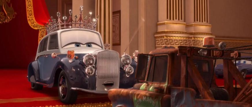 Cars 2En esta exitosa película, Disney Pixar le otorga un lugar a su Majestad, mostrándola como un auto con corona, reconociendo Mate con un título de caballero real. 